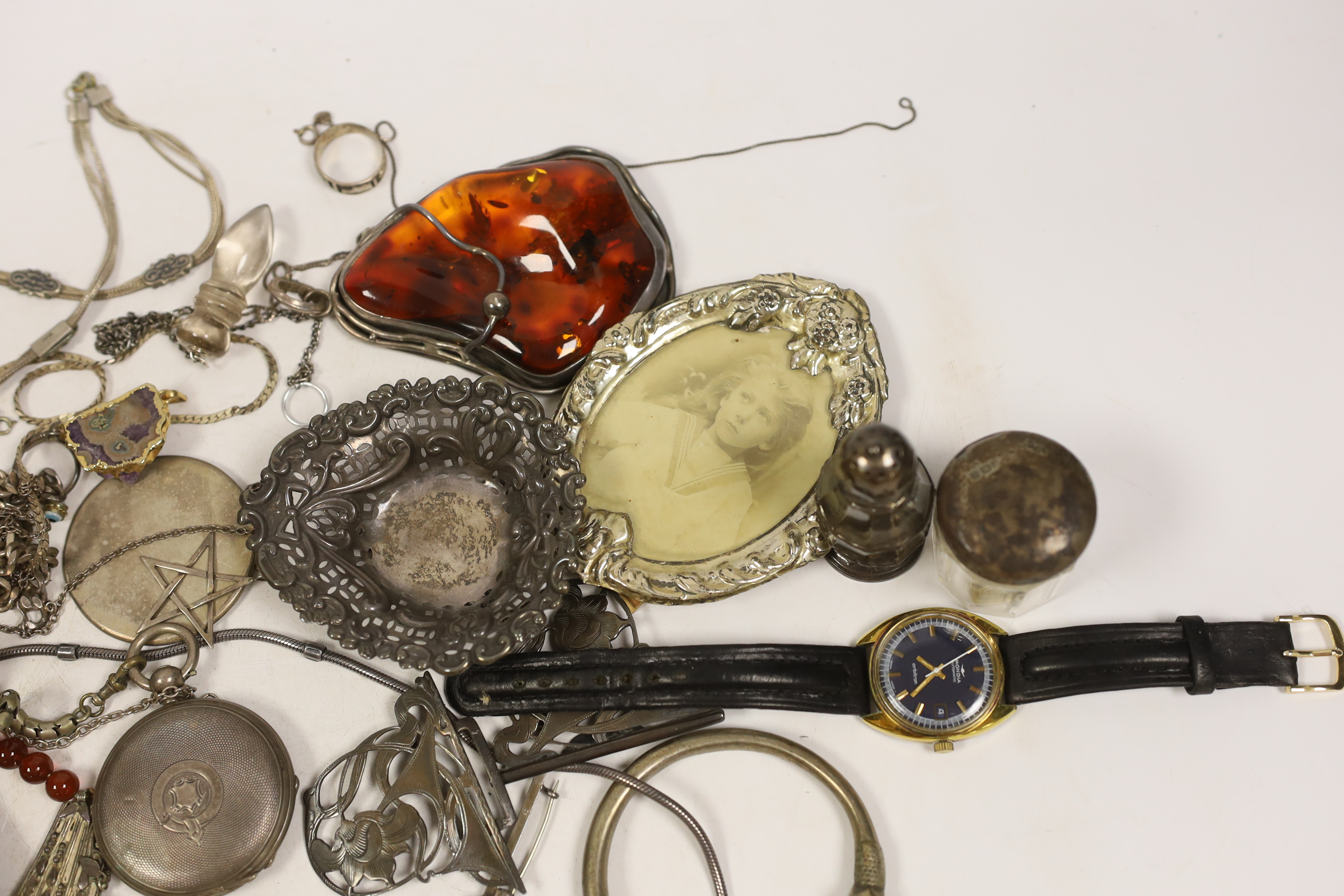 Miscellaneous silver including cigarette case, pepperette, bonbon dish, vesta case and belt buckle, a wrist watch and pocket watch and assorted jewellery including a large sterling mounted amber pendant and a Charles Hor